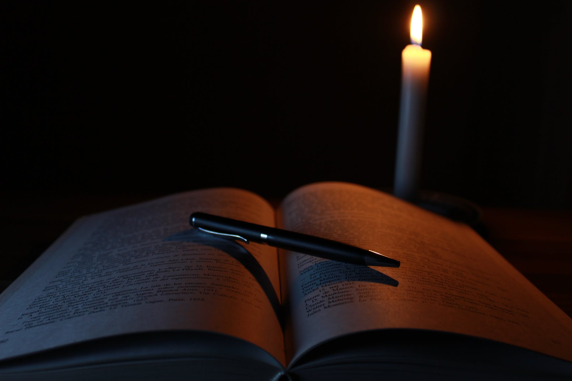 blur book candle close up